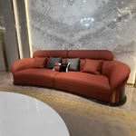 Curved Terracotta Leather Sofa and Blue Accent Chair Set with High-Gloss Wood Details